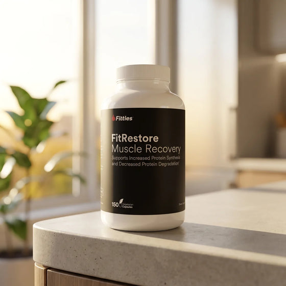 FitRestore HMB muscle recovery supplement bottle on a kitchen counter