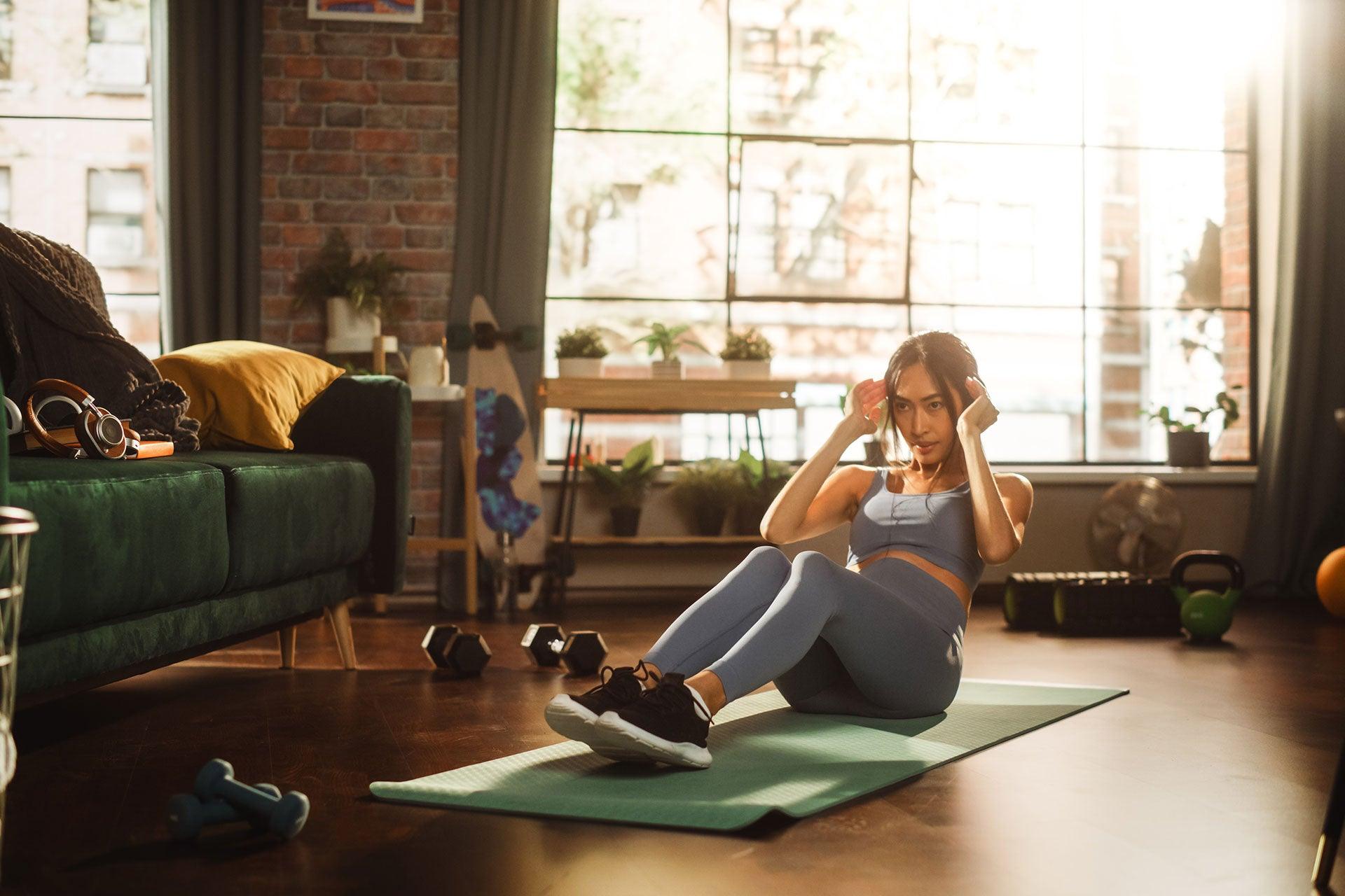 Female training in home gym