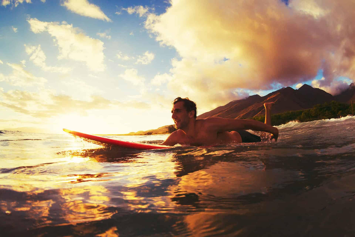 Man paddling out on surf board