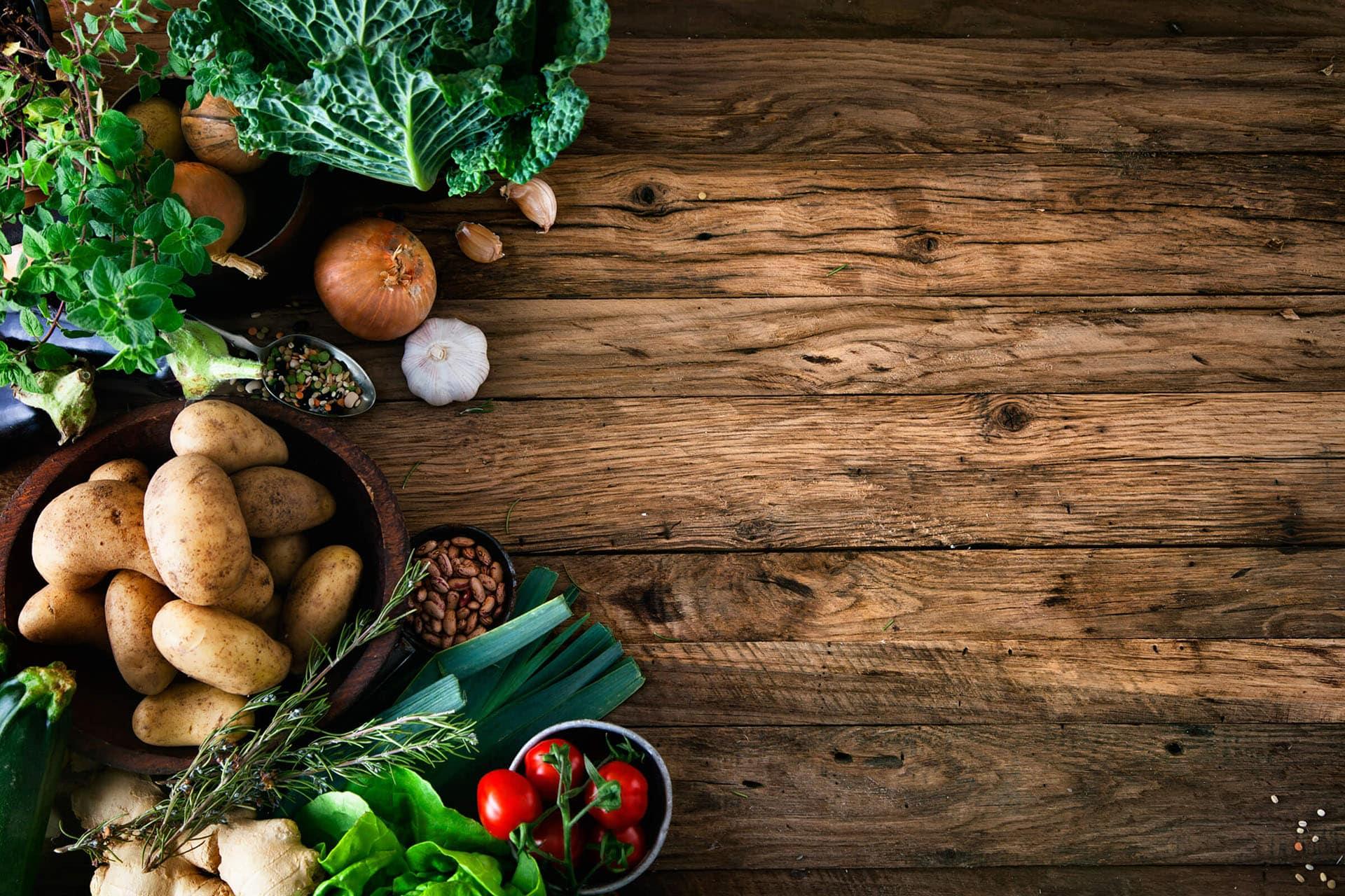 Spread of vegetables on rustic wood table