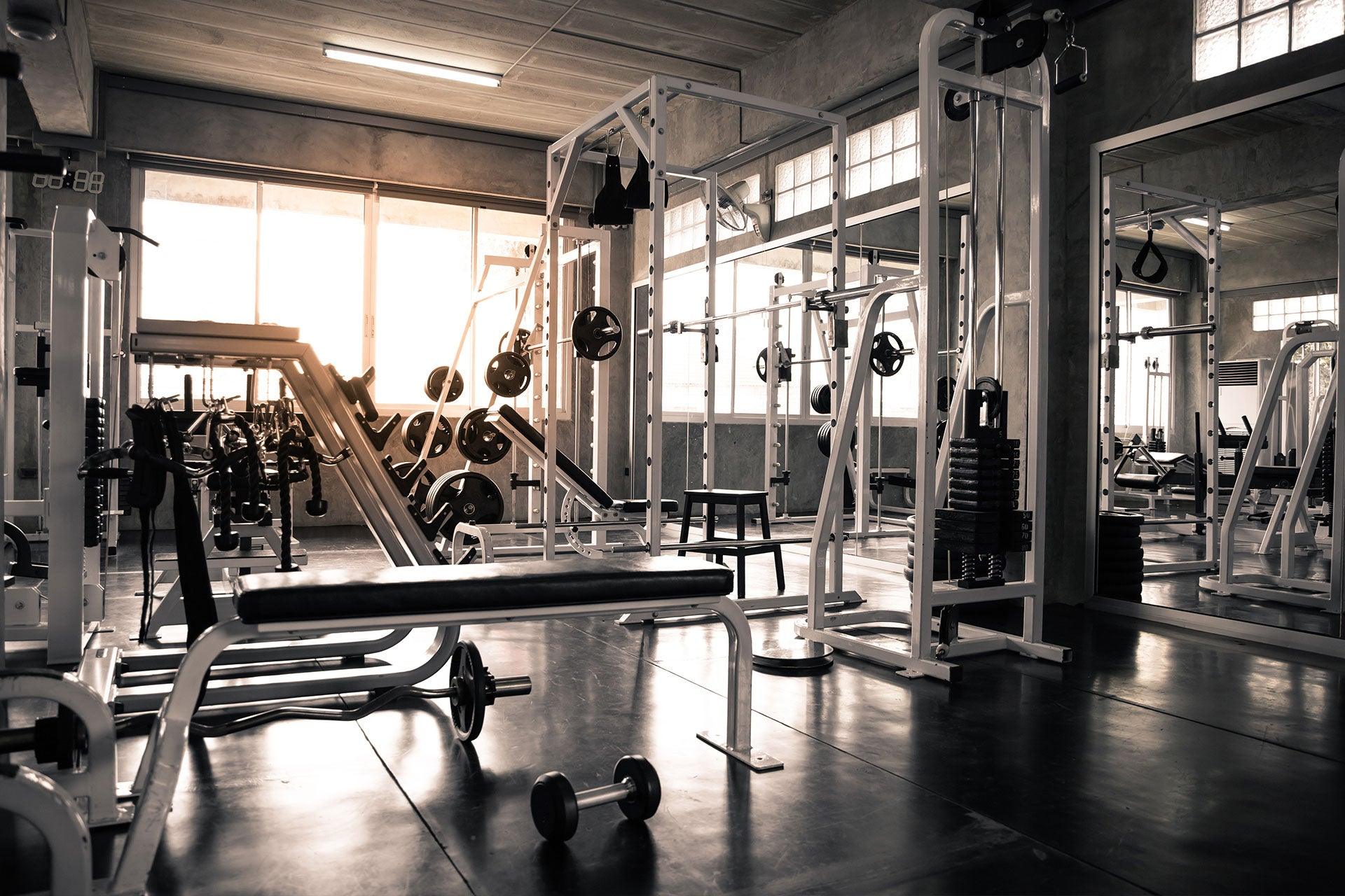 Wide view of variety of equipment in gym weightroom