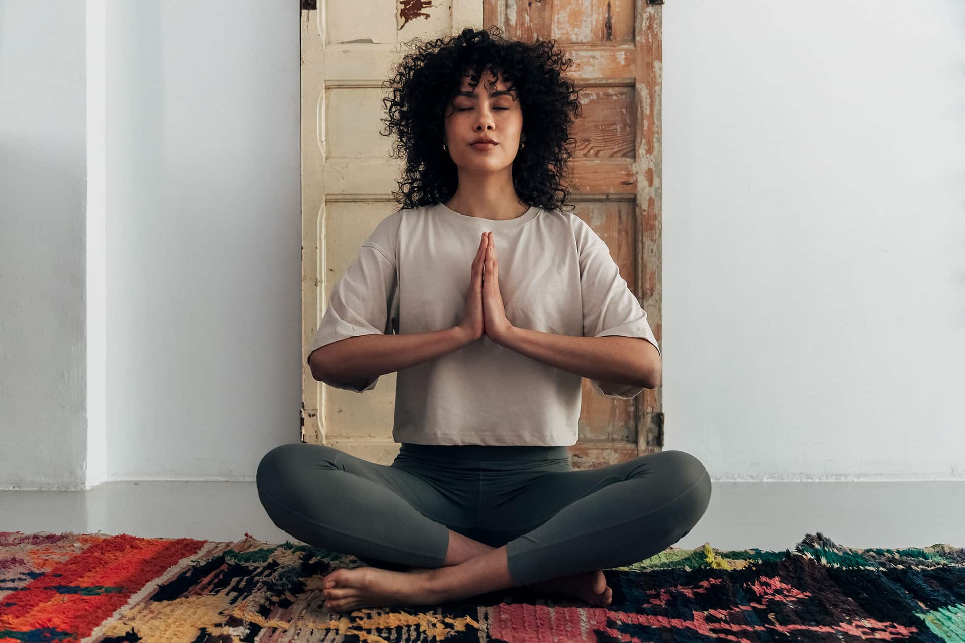 Female in yoga prayer position