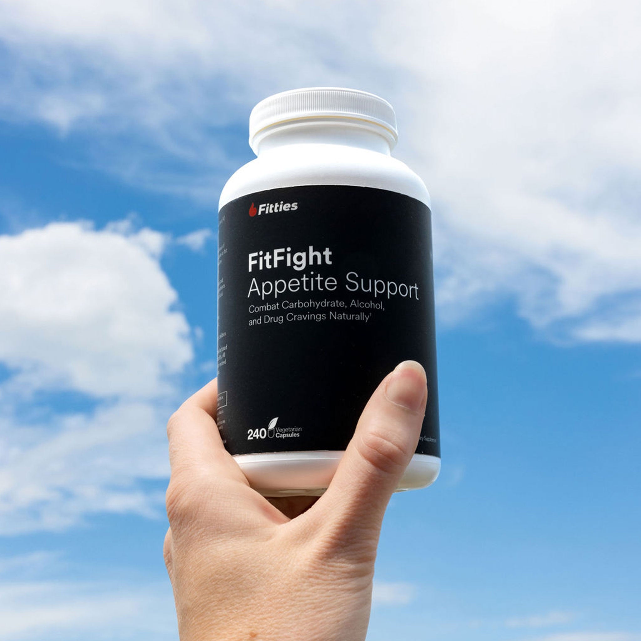 Bottle of Fitties FitFight in the clouds