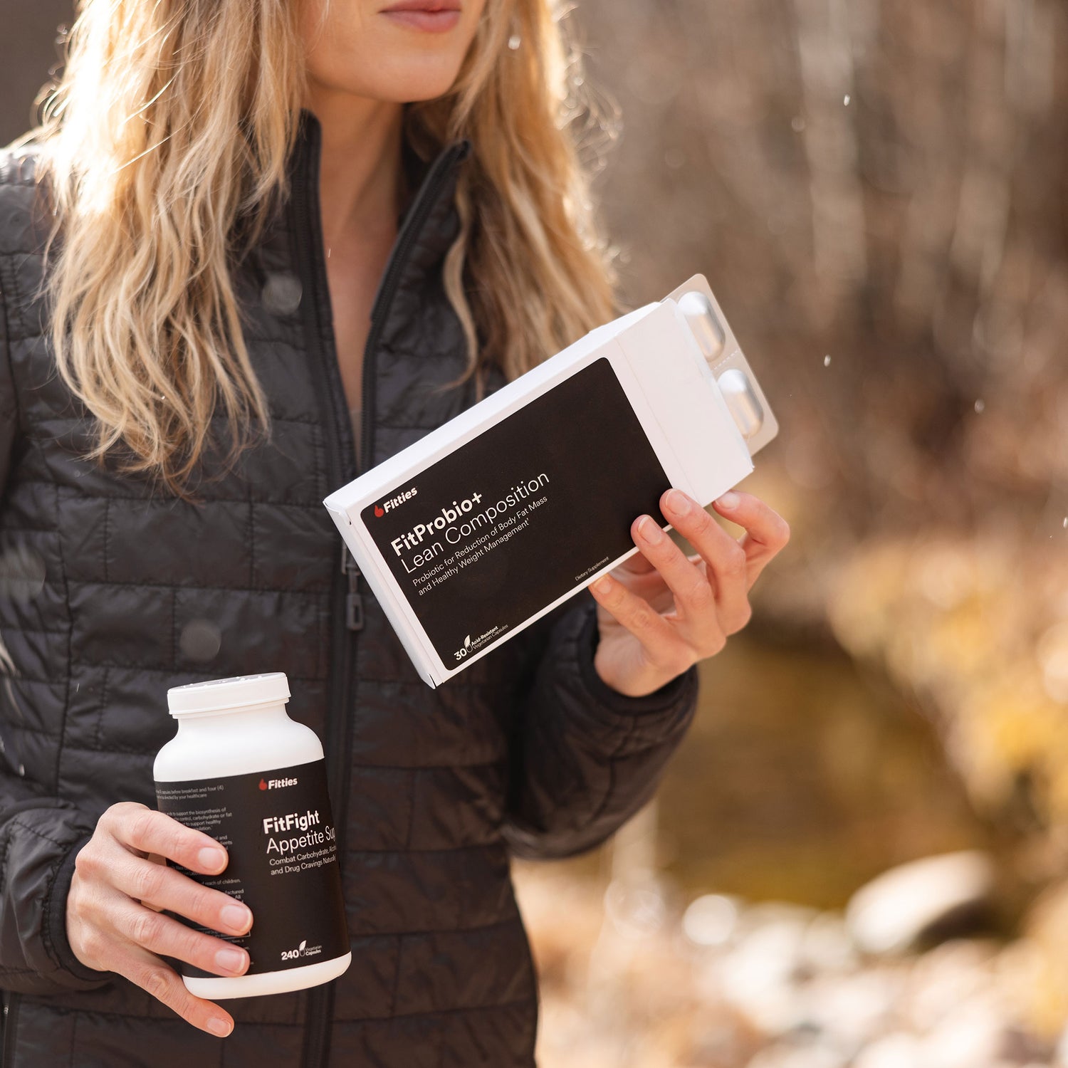 Closeup of female athlete with Fitties Weight Warrior Kit outdoors