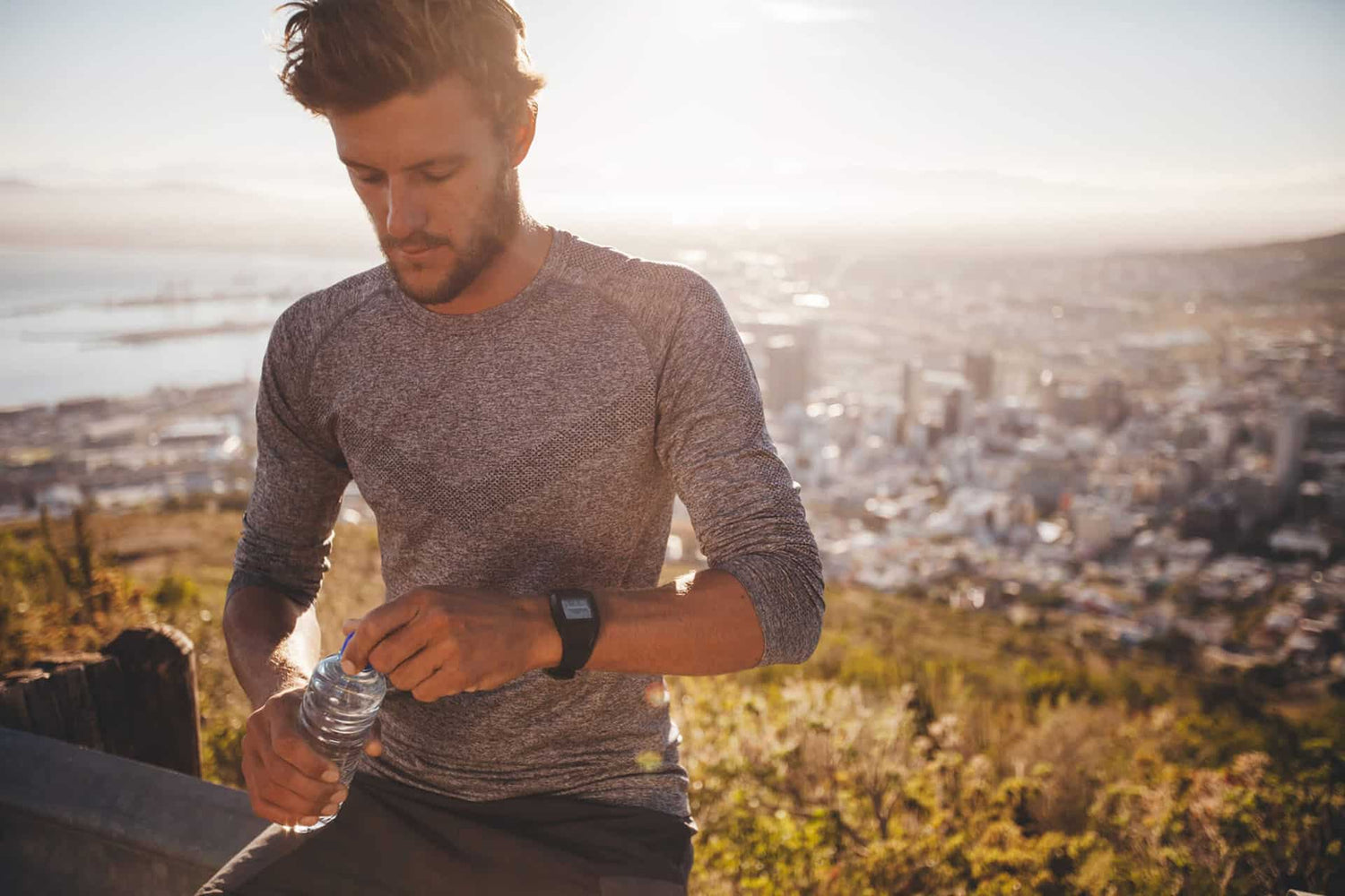 Fit male jogger taking a break during workout